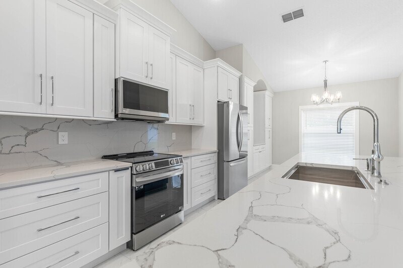 LIKE NEW, CUSTOM BUILT, FULLY FENCED 4/2/2 IN DESIRABLE PINE LAKES property image