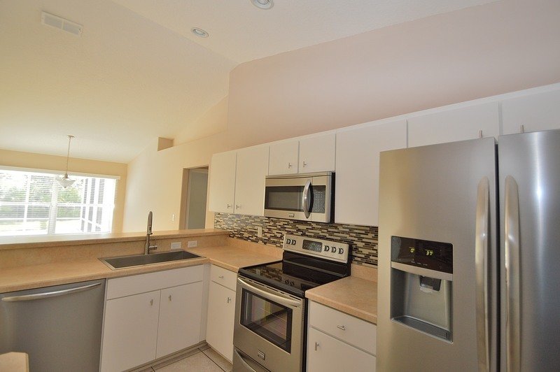 FULLY FENCED 3/2/2 POOL HOME IN THE HEART OF PALM COAST property image