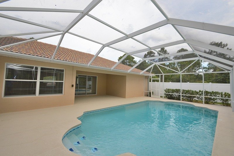 FULLY FENCED 3/2/2 POOL HOME IN THE HEART OF PALM COAST property image