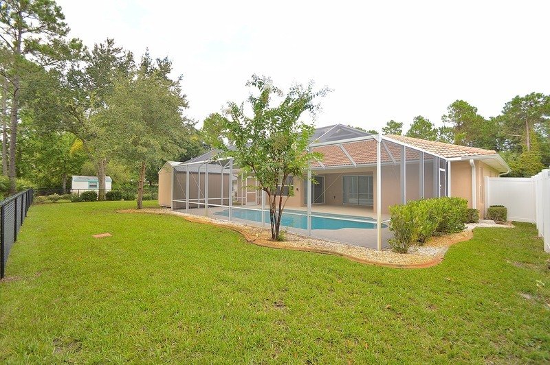 FULLY FENCED 3/2/2 POOL HOME IN THE HEART OF PALM COAST property image