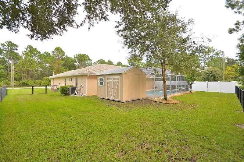 FULLY FENCED 3/2/2 POOL HOME IN THE HEART OF PALM COAST property image