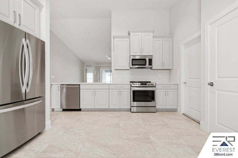 LIKE NEW, CUSTOM BUILT 4/3/2 IN BEAUTIFUL PINE LAKES property image
