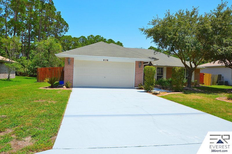 FULLY FENCED 4/2/2 POOL HOME IN THE HEART OF PALM COAST property image