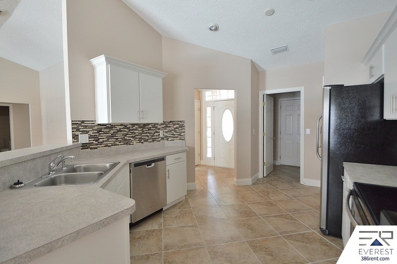 FULLY FENCED 4/2/2 POOL HOME IN THE HEART OF PALM COAST property image