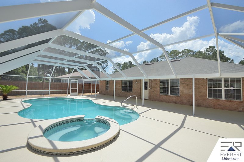 FULLY FENCED 4/2/2 POOL HOME IN THE HEART OF PALM COAST property image
