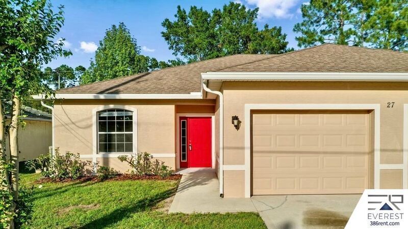 FULLY FENCED 3/2/2 TOWN HOME IN THE HEART OF PALM COAST property image
