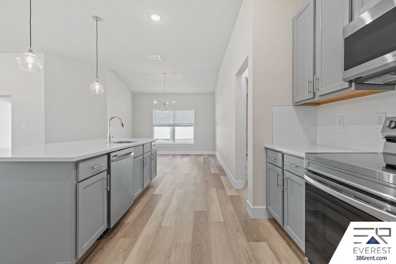 FULLY FENCED, UPGRADED 3/2/2 IN DESIRABLE PINE GROVE property image