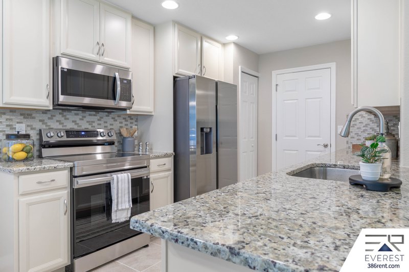 FULLY FENCED, LIKE NEW 3/2/2 IN DESIRABLE PINE LAKES property image