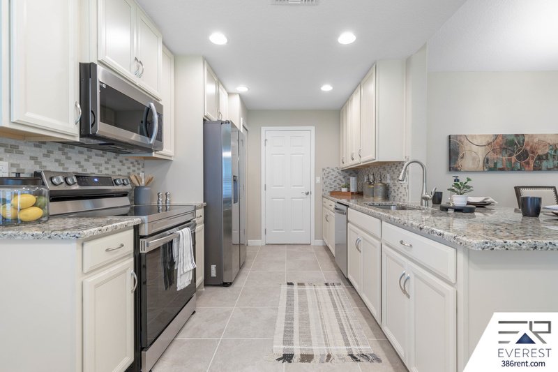 FULLY FENCED, LIKE NEW 3/2/2 IN DESIRABLE PINE LAKES property image