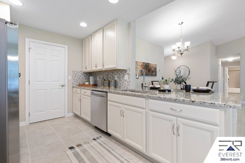 FULLY FENCED, LIKE NEW 3/2/2 IN DESIRABLE PINE LAKES property image