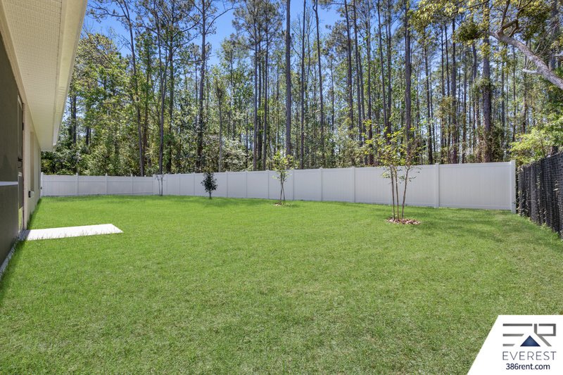 FULLY FENCED, LIKE NEW 3/2/2 IN DESIRABLE PINE LAKES property image