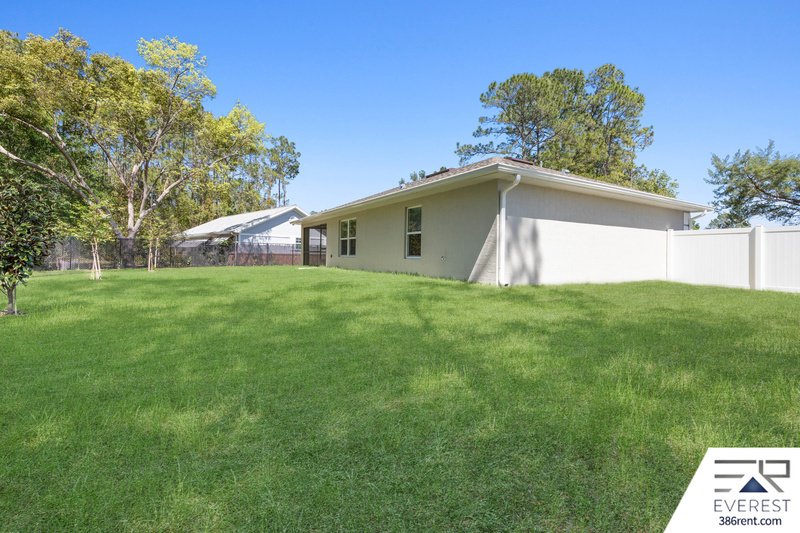 FULLY FENCED, LIKE NEW 3/2/2 IN DESIRABLE PINE LAKES property image