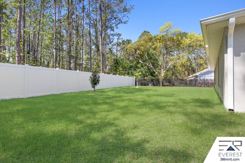 FULLY FENCED, LIKE NEW 3/2/2 IN DESIRABLE PINE LAKES property image