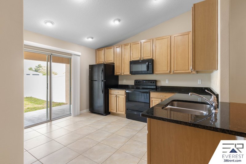 FULLY FENCED, LIKE NEW 3/2/1 IN DESIRABLE MATANZAS WOODS property image