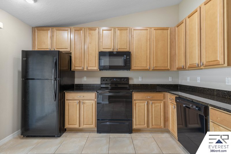 FULLY FENCED, LIKE NEW 3/2/1 IN DESIRABLE MATANZAS WOODS property image