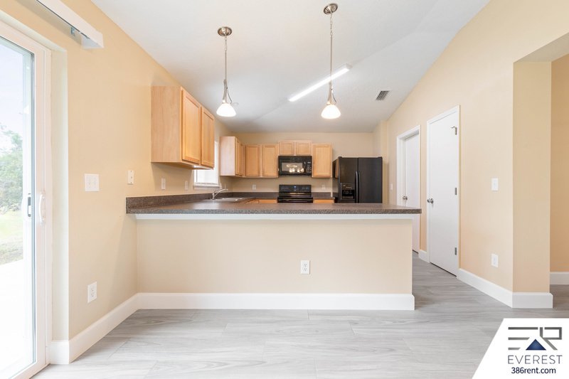 FULLY FENCED, LIKE NEW 3/2/1 IN POPULAR LEHIGH WOODS property image