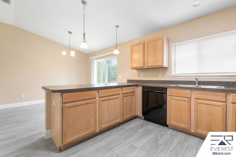 FULLY FENCED, LIKE NEW 3/2/1 IN POPULAR LEHIGH WOODS property image